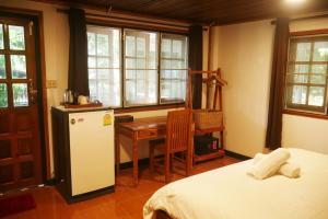 Postel nebo postele na pokoji v ubytování Big Elk Steak House - HomeStay + 31 fotografií