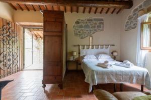 Een bed of bedden in een kamer bij Agriturismo Molinvecchio