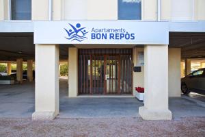 a building with a sign that readsagents bon repos at Apartamentos Bon Repós in Santa Susanna
