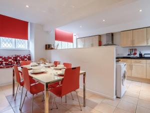 a dining room with a table and chairs in a kitchen at 3 Bed in Osmington 80374 in Broadmayne
