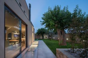 an external view of a house with a tree at Modern Villa Melon with outdoor pool in Porec in Krmenjak