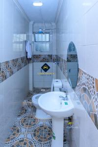 a bathroom with a sink and a toilet at Jalde Heights, Limuru Road, 178, Nairobi City, Nairobi, Kenya in Nairobi