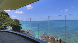 a view of the ocean from a house at VallonEnd Beachfront villa with excellent view in Bel Ombre