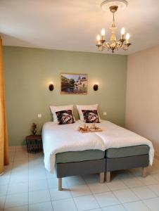 Postel nebo postele na pokoji v ubytování Hotel Rêve de la Vallée