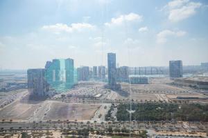 an aerial view of a city with tall buildings at Stunning Studio In Gate Tower in Abu Dhabi