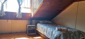 a small bedroom with a bed and a window at HOME AWAY FROM HOME in Cape Town