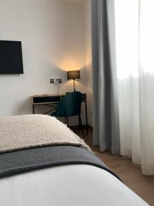 Postel nebo postele na pokoji v ubytování Hotel San Miguel Menorca