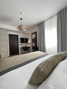 Postel nebo postele na pokoji v ubytování Hotel San Miguel Menorca
