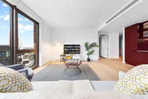 a living room with a couch and a table at Central London New 2 bedroom flat Riverview Balcony in London