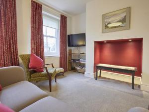 a living room with a couch and a table at 2 Bed in Keswick SZ009 in Keswick