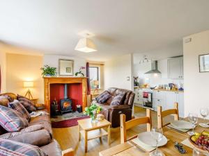 a living room with a couch and a fire place at 3 Bed in Todmorden 82953 in Todmorden