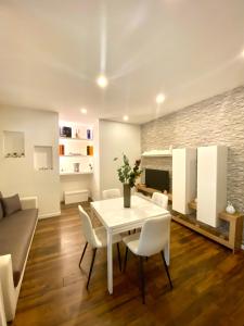 a living room with a white table and chairs at A&A B&B Bari in Bari +16 photos