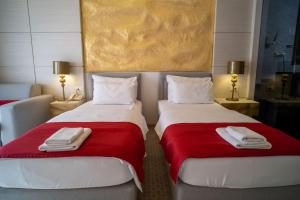 Кровать или кровати в номере Hotel Atina