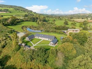 an aerial view of a large house in a field at 1 Bed in Talybont-on-Usk 88138 in Talybont
