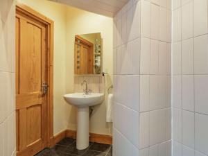 a bathroom with a sink and a mirror at 1 Bed in Crieff 87497 in Crieff