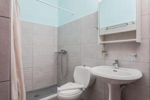 a bathroom with a sink and a toilet and a shower at Vigla-Βίγλα 1 2 in Órmos Marathokámpou +88 photos