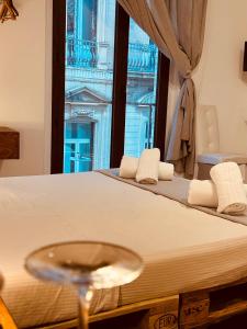a hotel room with a bed with a window at B&B Degli Artisti in Lecce