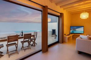 a living room with a view of the ocean at Villas Mont-Blanc in Reguengos de Monsaraz