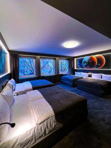 Postel nebo postele na pokoji v ubytování Sleephotels Cosmos