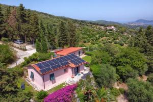an aerial view of a house with solar panels on the roof at Villetta San Martino in Portoferraio