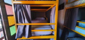 Palanda nebo palandy na pokoji v ubytování Hostel Rota 027 Itacaré