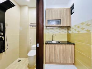 a small bathroom with a sink and a toilet at DREAM HOUSE in Ho Chi Minh City