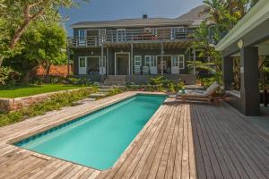 a swimming pool in the backyard of a house at Villa Blu Guesthouse in Hermanus
