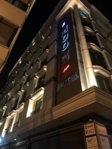 a building with a sign on the side of it at MOONLİGHT HOTEL in Bostaniçi