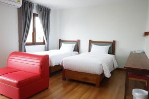 Postel nebo postele na pokoji v ubytování Tai-Shan Suites