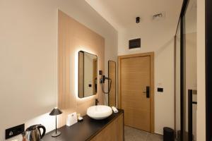 Kupatilo u objektu Hop Inn Rooms & Suites