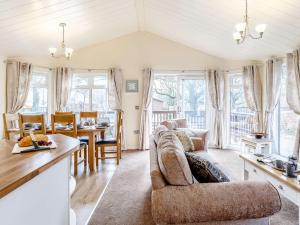 a living room with a couch and a table at 3 Bed in Dartmoor National Park 06199 in Okehampton