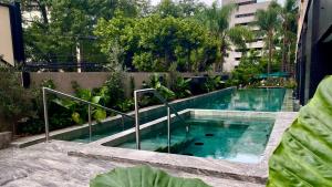 a swimming pool in the middle of a building at Grand Fiesta Americana Guadalajara Country Club in Guadalajara