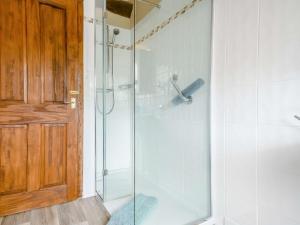 a shower with a glass door in a bathroom at 2 Bed in Bretforton 89476 in Bretforton +8 photos