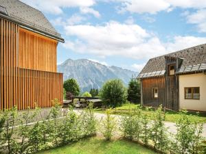 a view of the mountains from the courtyard of a house at Mountain Lovers Three by AA Holiday Homes in Tauplitz