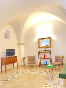 a living room with a couch and a table at A&A B&B Martina Franca in Martina Franca