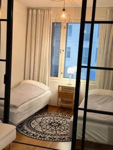 Postel nebo postele na pokoji v ubytování JATKASAARI-2 - Chic and cosy Sea side stay