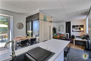 a kitchen and living room with a counter top at La maison de lannion in Lannion