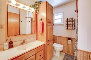 a bathroom with a sink and a toilet at Bitely Cottage Rental Fire Pit and Beach! in Bitely +28 photos