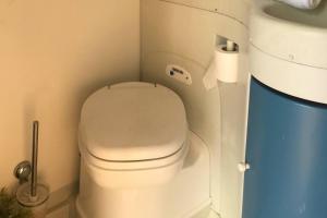 a bathroom with a toilet and a roll of toilet paper at Akisol Azeitão Ride in Azeitao +7 photos
