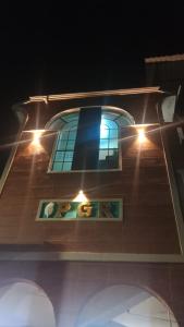a building with a window with lights on it at PGR Thirunallar in kāraikāl