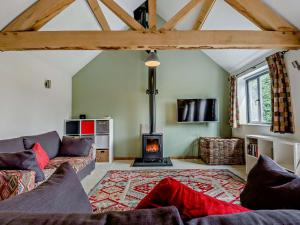 a living room with a couch and a fireplace at 1 bed property in Lechlade 31912 in Lechlade