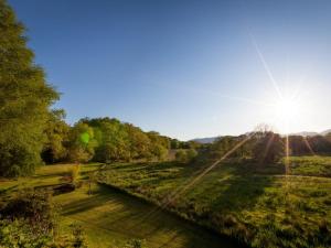 a view of a river with the sun in the sky at 1 bed in Appin 28686 in Acharra