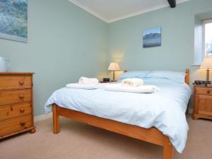 a bedroom with a bed with two towels on it at 1 bed in Wolsingham 36672 in Wolsingham