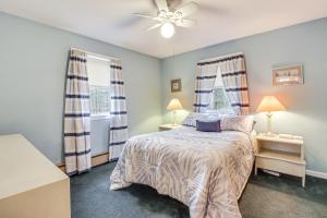 a bedroom with a bed and two windows at 6 Mi to Jack Frost Ski Resort Family Home with Deck in Blakeslee