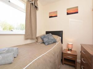 a bedroom with a bed and a window at 3 bed property in Mablethorpe 43220 in Mablethorpe
