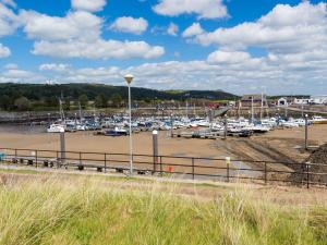 a marina with a bunch of boats in the water at 1 Bed in Kidwelly 43406 in Kidwelly