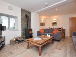a living room with a couch and a wood stove at 2 bed in Chapel-en-le-Frith PK346 in Chapel en le Frith
