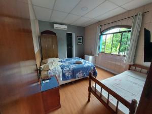 Giường trong phòng chung tại Pousada Casa Familia +79 ảnh