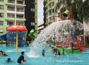 a group of children playing in a water park at PoolView Waterpark 300Mbps Ipoh Homestay Manhattan Condo 4-7pax 3bedroom Station 18 pengkalan in Ipoh