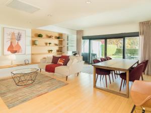 a living room with a couch and a table at Scala Cascais Top apartment in Cascais